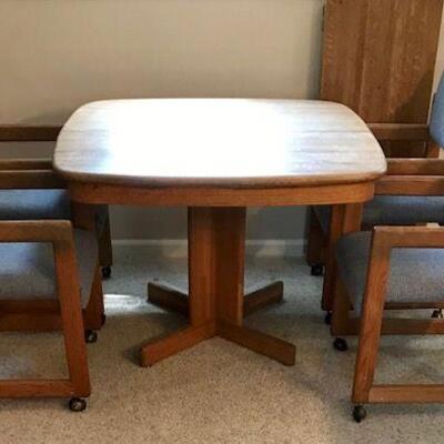 Oak Dining Table With Four Padded Chairs And Leaf