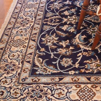 Lot 100  Large area rug unknown fiber Persain style design blues and browns