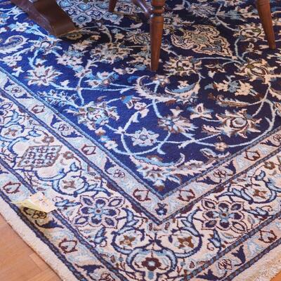 Lot 100  Large area rug unknown fiber Persain style design blues and browns