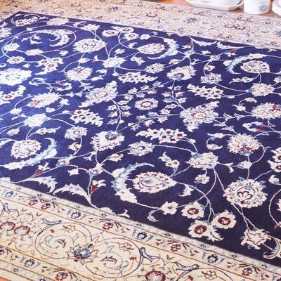 Lot 113 Persian Style area rug with night sky blue and light tan borders