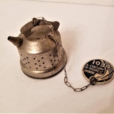 Lot #19  Souvenir from 1934 Chicago World's Fair - Tea Strainer/Steeper/Infuser