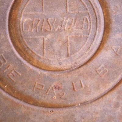 Lot 46  Antique Griswold caldron with Cross logo and Erie PA logo