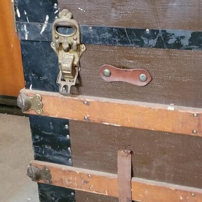 Lot 115: Antique Steamer Trunk with Remnant leather Straps & Leather Handles (one handle broken)  34.5" Ã— 19" Ã— 22.25"