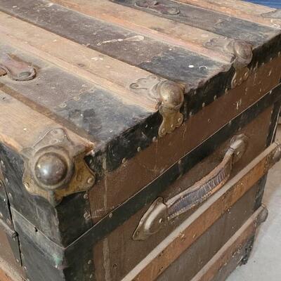 Lot 115: Antique Steamer Trunk with Remnant leather Straps & Leather Handles (one handle broken)  34.5" Ã— 19" Ã— 22.25"