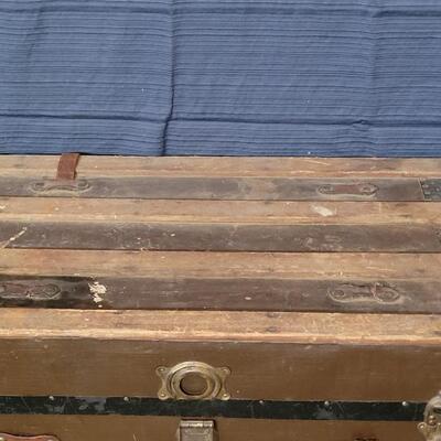 Lot 115: Antique Steamer Trunk with Remnant leather Straps & Leather Handles (one handle broken)  34.5" Ã— 19" Ã— 22.25"