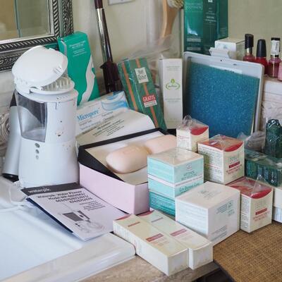 Lot 85 New cosmetics used waterpik and other toiletry supplies