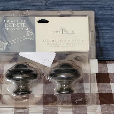 Lot 121: New in Package Finials 