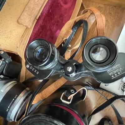 Lot 94 Huge lot of film and digital cameras, manuals, lens, cases, Binoculars, book
