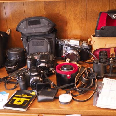 Lot 94 Huge lot of film and digital cameras, manuals, lens, cases, Binoculars, book