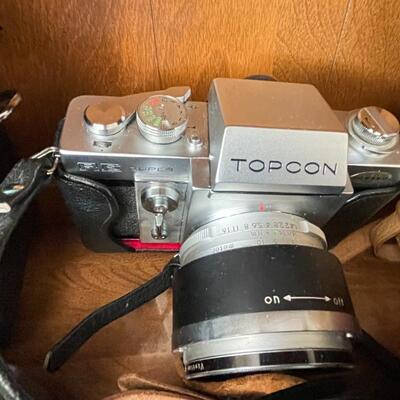Lot 94 Huge lot of film and digital cameras, manuals, lens, cases, Binoculars, book