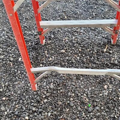 Lot 145: 9.5 Foot Fiberglass and Aluminum Ladder 