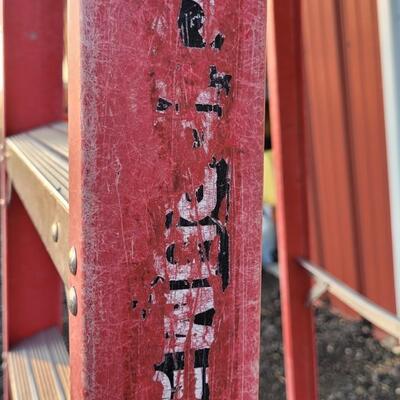Lot 145: 9.5 Foot Fiberglass and Aluminum Ladder 