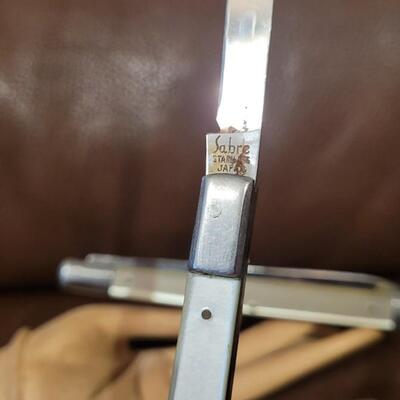 Lot 174: (2) 5" Single Blade Pocketknives (SABRE and OMOR)