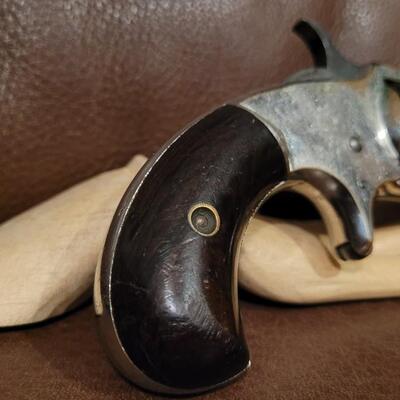 Lot 181: Antique 1878 J.W. MARLIN .30 Cal Short Rimfire Spur Trigger Bird's Eye Butt Revolver