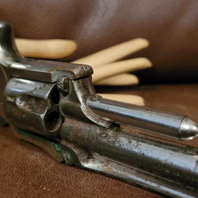 Lot 181: Antique 1878 J.W. MARLIN .30 Cal Short Rimfire Spur Trigger Bird's Eye Butt Revolver