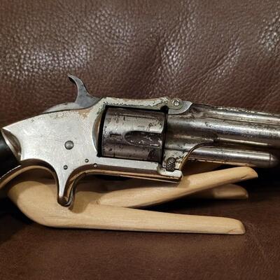Lot 181: Antique 1878 J.W. MARLIN .30 Cal Short Rimfire Spur Trigger Bird's Eye Butt Revolver