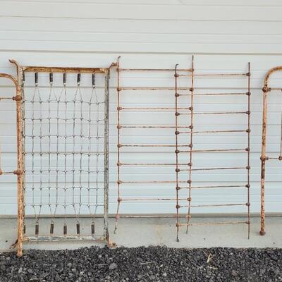 Lot 207: Antique Metal Baby Bed (has aged chippy pink paint- deco only)