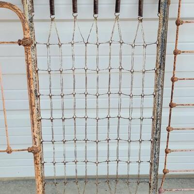 Lot 207: Antique Metal Baby Bed (has aged chippy pink paint- deco only)