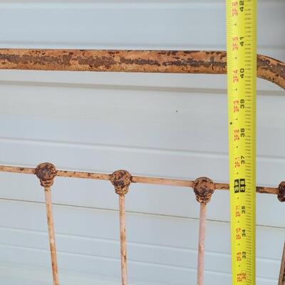 Lot 207: Antique Metal Baby Bed (has aged chippy pink paint- deco only)