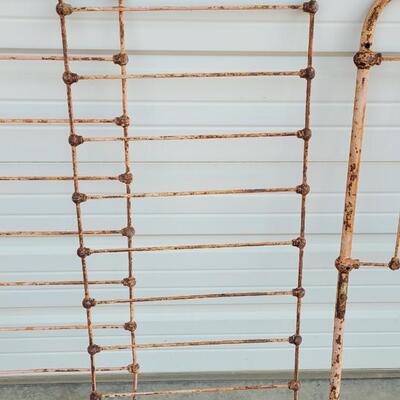 Lot 207: Antique Metal Baby Bed (has aged chippy pink paint- deco only)