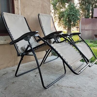 Lot 245: (2) Folding Patio Chairs Zero Gravity 