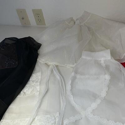 Lot 221  Six Vintage Aprons