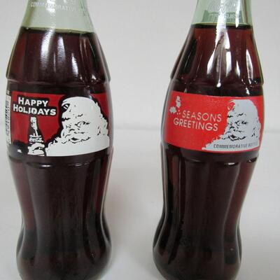 2 Different Vintage Coca Cola Christmas Bottles With Santa