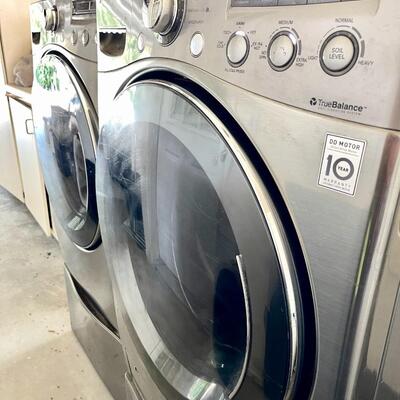LOT 21  PAIR OF LG STAINLESS STEEL FRONT LOADING WASHER & GAS DRYER W/BASES Pick up after Sept. 14.  