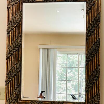 LOT 57  WOOD FRAMED W/LEAF MOTIF BEVELED MIRROR