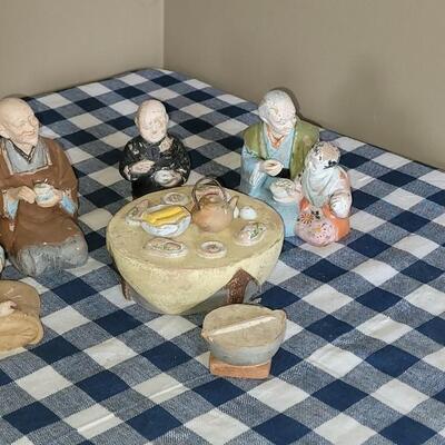 Lot 57: Antique Chalkware Asian Family Enjoying a Meal Together Figures 