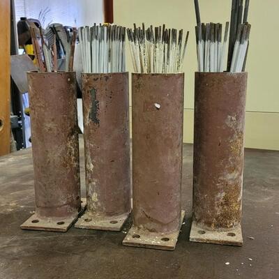 Lot 148: Assortment of Welding Rods w/ Case Iron Holders