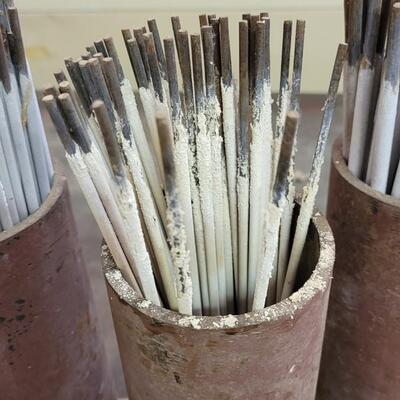 Lot 148: Assortment of Welding Rods w/ Case Iron Holders