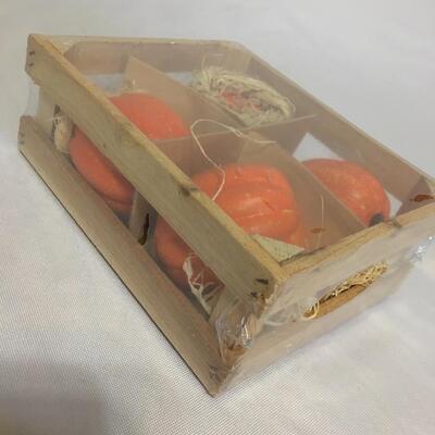 Crate with ceramic miniature pumpkin 