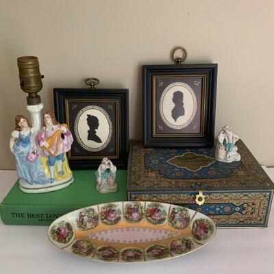 Lot 036: Whitman Vintage Cloisonne Tin, Framed Silhouettes, Figural Porcelain Lamp & More