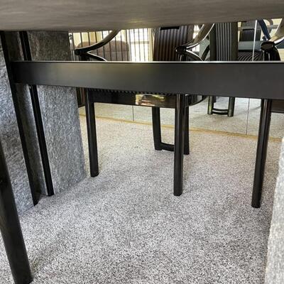  Granite Slab dining table with 6 ;acquired ash chairs upholstered in black and grey stripes.