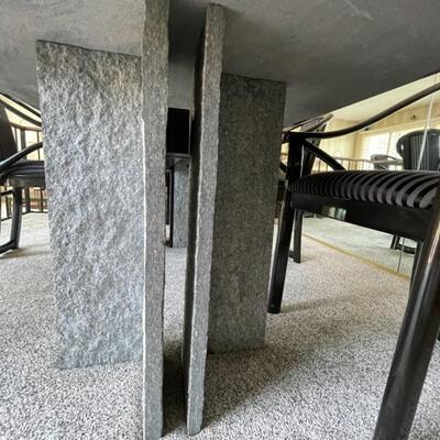  Granite Slab dining table with 6 ;acquired ash chairs upholstered in black and grey stripes.