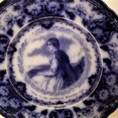 Lot #119  Fantastic Antique Flow Blue Plate featuring "Evangeline" - poem on reverse