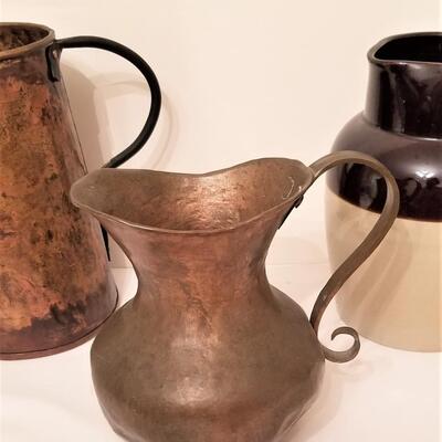 Lot #130 Lot of 3 pitchers - copper & stoneware