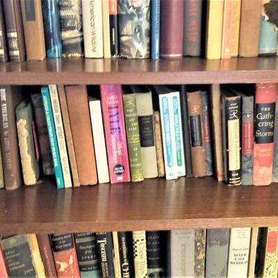 Lot #148  Lot of over 100 hardcover books (bookcase not included).