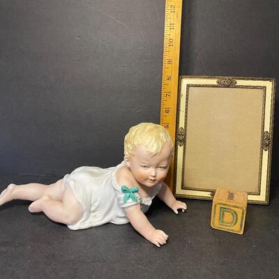 Lot 013:  Vintage Porcelain Figural Piano Baby & Vintage Picture Frame
