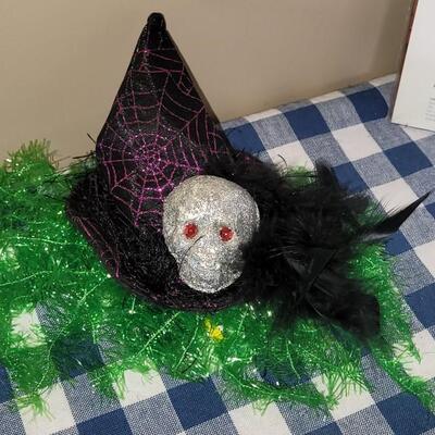 Lot 284: Halloween Table Runners, Dia de los Muertos Towel,Plastic Tablecloth and Hat 