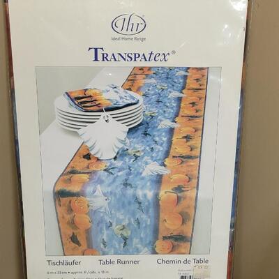 Lot 284: Halloween Table Runners, Dia de los Muertos Towel,Plastic Tablecloth and Hat 