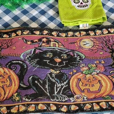 Lot 284: Halloween Table Runners, Dia de los Muertos Towel,Plastic Tablecloth and Hat 