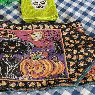 Lot 284: Halloween Table Runners, Dia de los Muertos Towel,Plastic Tablecloth and Hat 