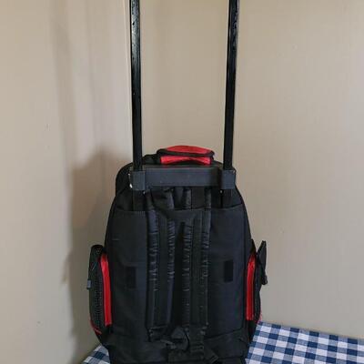 Lot 332: Primerica Rolling Red Backpack