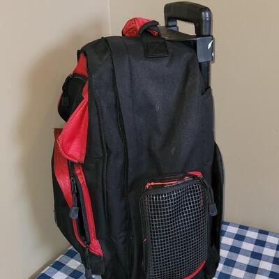 Lot 332: Primerica Rolling Red Backpack