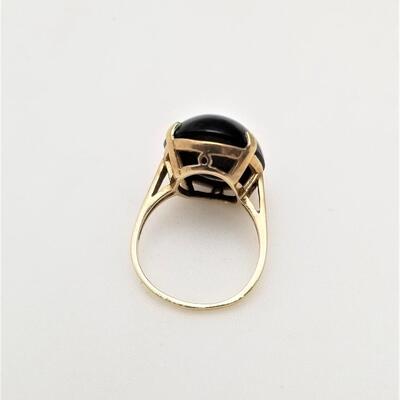 Lot #247   10kt gold ring with black Cabochon stone
