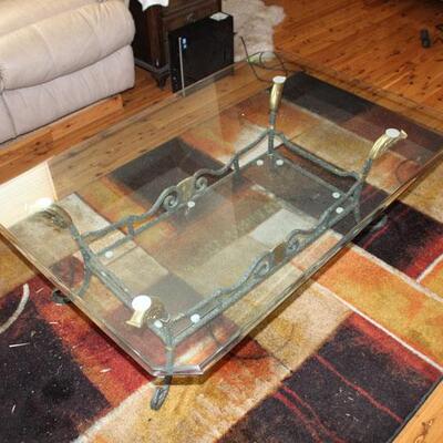 Glass top, metal base coffee table
