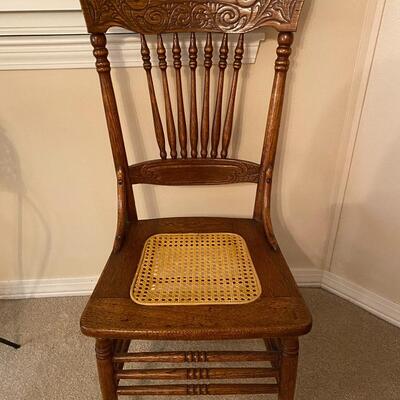 Antique oak pressed back chair with cane seat
