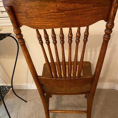 Antique oak pressed back chair with cane seat